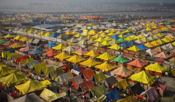 ALLAHABAD, INDIA - JANUARY 14: An areal view of a tent city built for hindu pilgrims on the auspicious bathing day of Makar Sankranti festival on a foggy winter morning, during month-long annual Magh Mela, on January 14, 2023 in Allahabad, India. Makar Sankranti usually falls on either January 14 or 15, and is a significant event in the Hindu calendar that celebrates the lord Surya, or the sun. The date of the festival coincides with the astrological phenomenon of the sun entering Capricorn. (Photo by Ritesh Shukla/Getty Images)