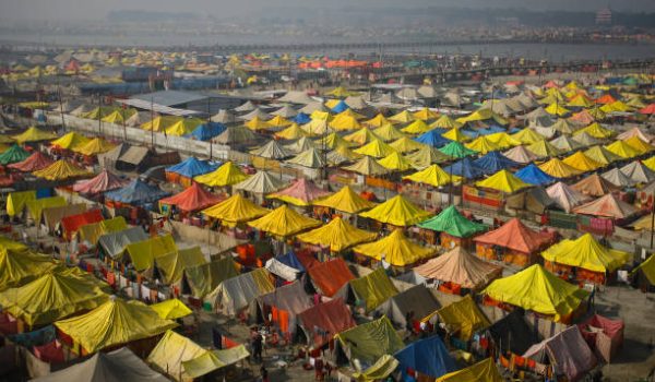 brand ALLAHABAD, INDIA - JANUARY 14: An areal view of a tent city built for hindu pilgrims on the auspicious bathing day of Makar Sankranti festival on a foggy winter morning, during month-long annual Magh Mela, on January 14, 2023 in Allahabad, India. Makar Sankranti usually falls on either January 14 or 15, and is a significant event in the Hindu calendar that celebrates the lord Surya, or the sun. The date of the festival coincides with the astrological phenomenon of the sun entering Capricorn. (Photo by Ritesh Shukla/Getty Images)